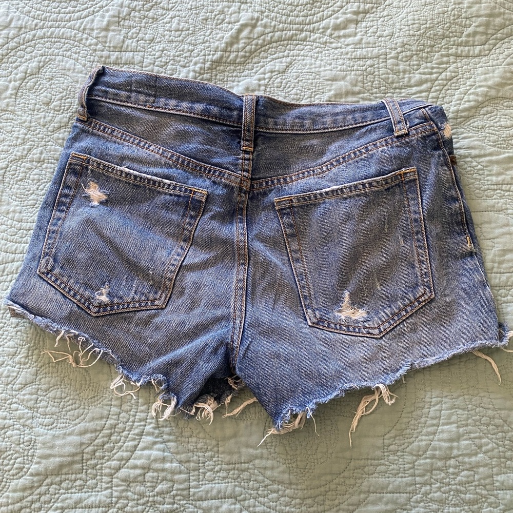 We the Free Free People mid-rise distressed medium fade blue jean shorts size 26